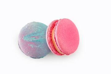 Sweet colorful macarons isolated on white background. Tasty colourful macaroons. Two multi-colored blue and pink macaroons. French pastry made from egg whites.
