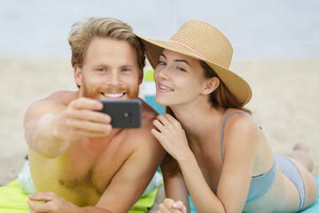 couple and selfie on the beach