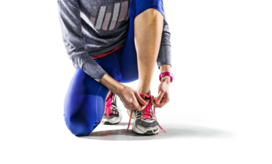 Sports transparent background. A young female runner is ready for a workout in her sports shoes.	