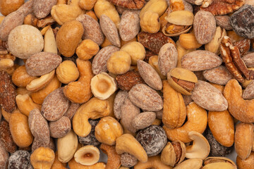 A group of almonds, pistachios, walnuts, macadamia, cashews.