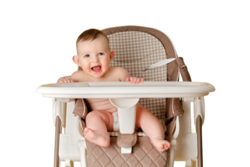 Happy baby sits on a high chair for feeding children, isolated on a white background. Smiling child boy at the age of six months eating while sitting on a baby chair, copy space