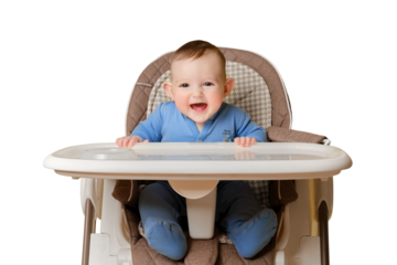 Happy baby sits on a high chair for feeding children, isolated on a white background. Smiling child boy at the age of six months eating while sitting on a high chair, copy space