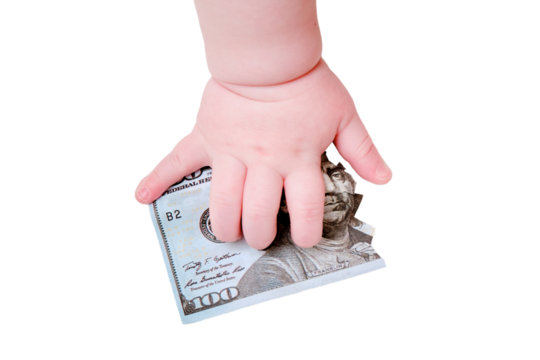 Baby hand and torn money in ?? dollars, close-up, isolated on a white background. Children fingers and an object on a white background