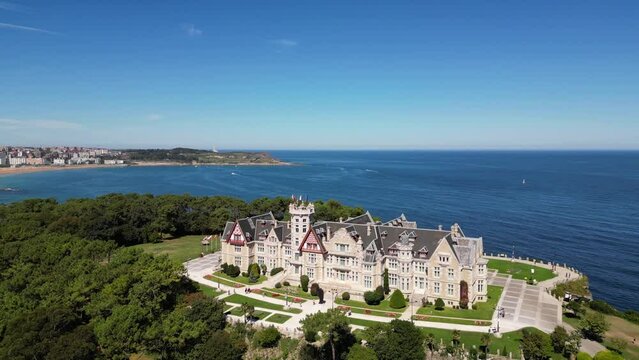 Magdalena Palace in Santander Spain with aerial view of the peninsula and the city with sunny beach in summer.	
