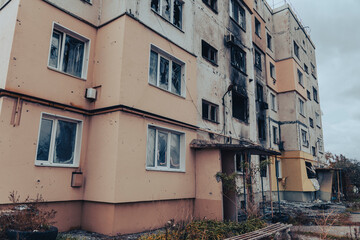 Fototapeta premium Entrance of a residential building destroyed by shelling. War in Ukraine