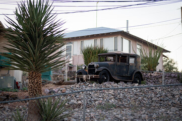 Old abandoned Ford Model A in the yard of a private house