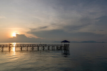 Walkway Jetty on the South China Sea on Mabul Island Borneo at sunset