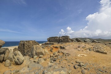 Beautiful view of rocky coast with ruins of Bushiribana to north of island of Aruba.