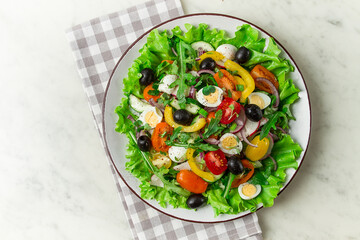 Fototapeta na wymiar Vegetable salad , with quail eggs and olives, fresh, close-up, no people,