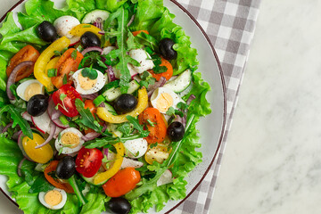 Vegetable salad , with quail eggs and olives, fresh, close-up, no people,