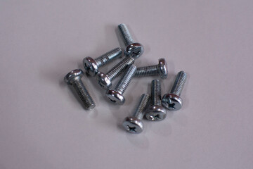 metal bolt isolated on black background. Chromed screw bolt. Steel bolt isolated. Nuts and bolts. Tools for work.