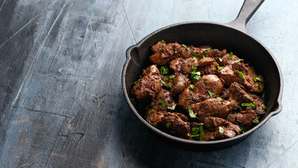Fried chicken liver, poultry meat food with herbs