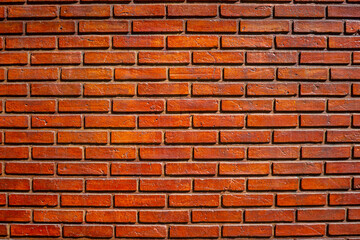 Fototapeta premium an old worn red brick wall