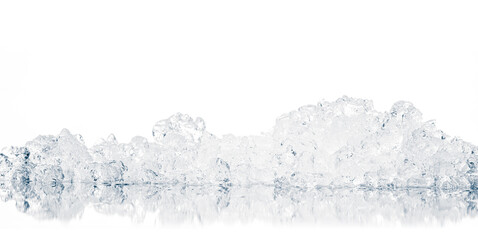 Natural crystal clear heap of crushed ice, melting ice cubes on the white reflective surface background.