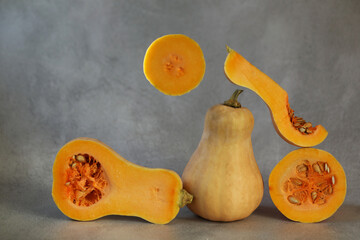 cut fresh pumpkin on the grey background