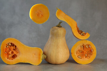 cut fresh pumpkin on the grey background