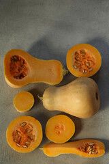 cut fresh pumpkin on the grey background