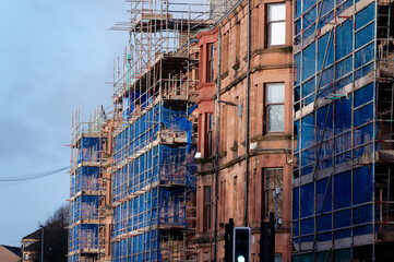 Scaffolding surrounding house development for safe access to construction work