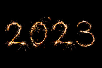 Obraz na płótnie Canvas 2023 written with Sparkle firework on black background, happy new year 2023 banner concept