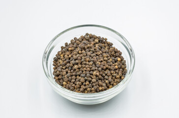 Black pepper closeup on white background