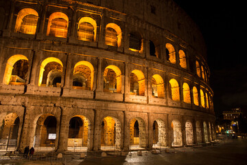 Fototapeta na wymiar The Colosseum at night. It is an oval amphitheatre in the centre of the city of Rome, Italy. It's called also Flavian Amphitheatre. 
