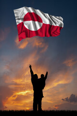 Father with son and the flag of Greenland