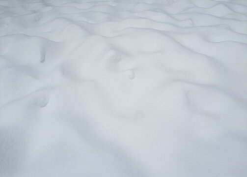 Uneven White Snow Surface On The Ground