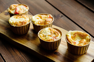 Cheese egg souffle on wooden background