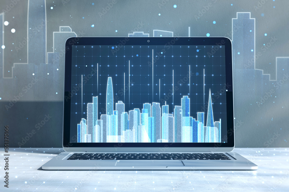 Poster close up of laptop screen at workpkace with abstract glowing city skyline hologram on blurry backgro
