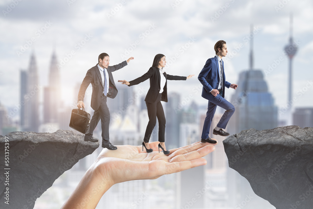 Aufkleber Creative image of team helping each other walk through obstacle on abstract city background with cliff gap. Teamwork, help, success and union concept.