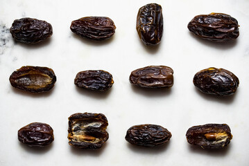 Dates fruit pattern on white background. Dried organic Superfood.