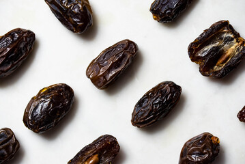 Dates fruit pattern on white background. Dried organic Superfood.