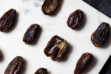 Dates fruit pattern on white background. Dried organic Superfood.