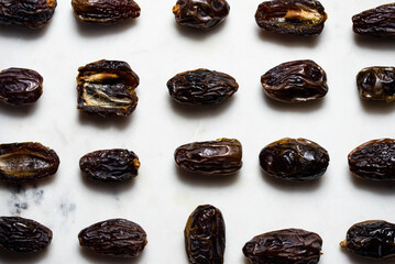 Dates fruit pattern on white background. Dried organic Superfood.