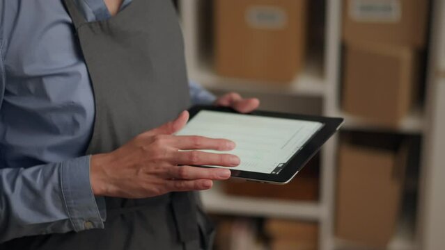 Customs Cargo Department Cargo Clearance Officer Carrying out Customs Declaration Clearing Cargo Online on Tablet Screen Online Commerce Paperwork Online Tablet
