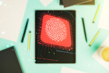 Multi exposure of creative fingerprint hologram and digital tablet on background, top view, personal biometric data concept