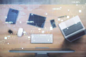 Multi exposure of abstract creative financial graph with world map on modern laptop background, forex and investment concept