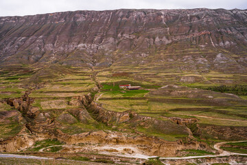 authentic nature of dagestan and its mountainous terrain and beautiful rocky views, mountains and a farm house farm against the backdrop of all the beautiful landscapes