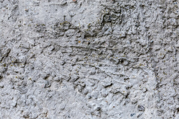 Fragment of the old concrete wall, outdoors in overcast weather