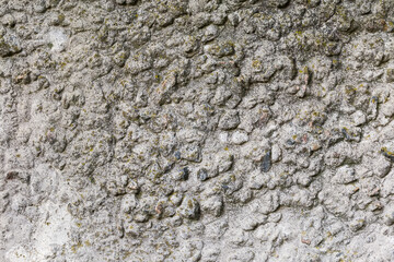 Fragment of the old concrete wall, outdoors in overcast weather