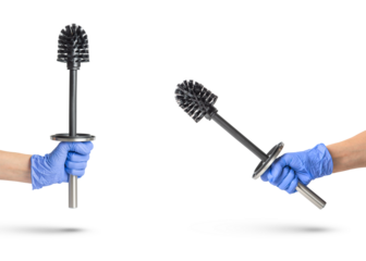 Toilet brush in hand on a white isolated background, a hand in a blue rubber glove holds a black chrome toilet brush