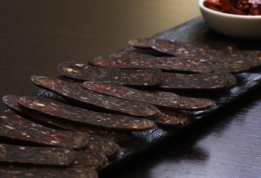 Beef Sujuk, shuzhuk or chuchuk. A delicacy "jerky", cured thinly sliced sausage. Traditional dish, appetizer on the Christmas table of the Caucasian peoples. New Year