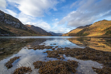 Naklejka premium Loch Hourn in Autumn with blue sky and reflections in water