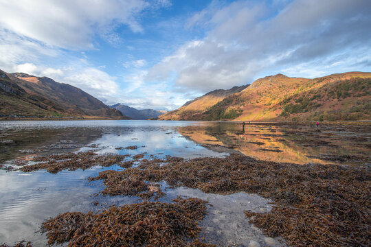 Sun shining over Loch Hourn with blue sky