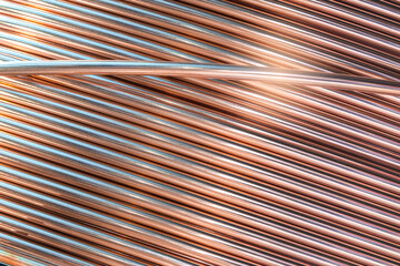 Coil of copper wire for welding tools and other industrial applications, industry concept background
