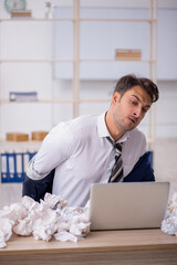 Young male employee in rejected ideas concept
