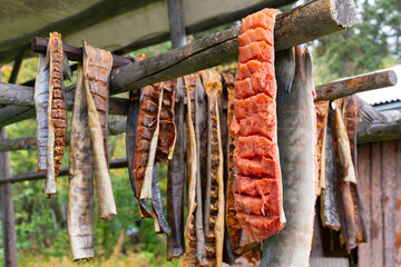 Salmon drying in a smoke house in Alaska - obrazy, fototapety, plakaty