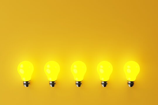 Several illuminated yellow light bulbs on a yellow background. The concept of the formation of ideas, creativity, problem solving. 3d render