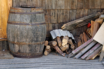 Old vintage barrel and pile of wooden fire