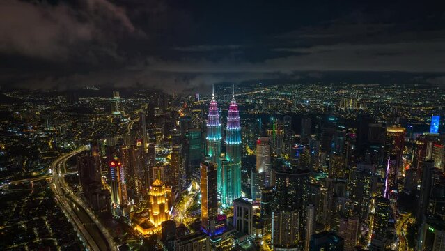 4K Aerial Hyperlapse of KLCC during night view. the colour of KLCC is for Opening day of MotoGP.